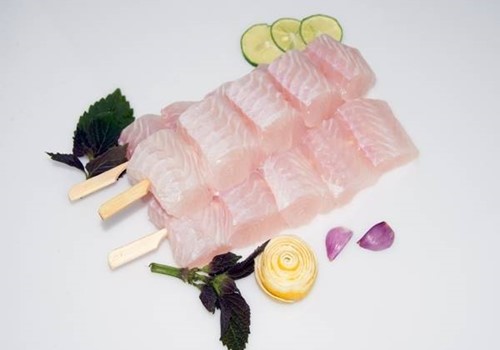 FROZEN PANGASIUS CUBES, WELL TRIMMED 